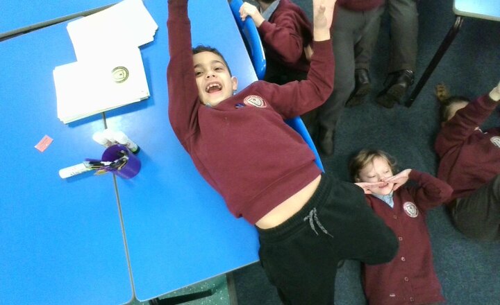 Image of In English today we have been thinking about the horror of falling off a boat. We have used freeze frames to show how our bodies and faces would show how we would act and feel.