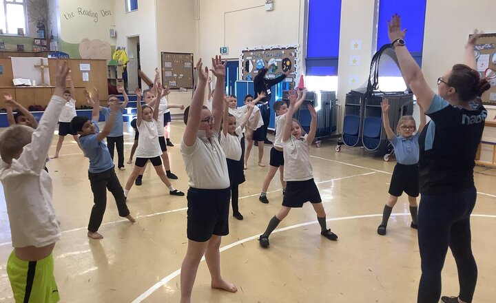 Image of Year 3 showing excellent enthusiasm putting together a dance routine.