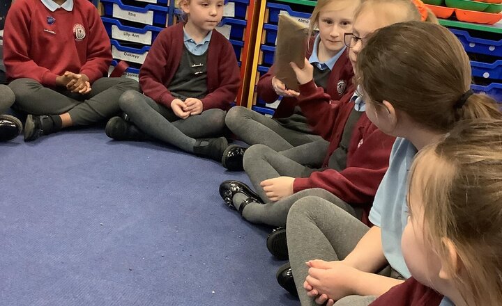 Image of Our RE topic this term is Easter. We are looking at how symbols help us understand the Easter story.  Yesterday we played pass the parcel with different parts of the story, we then put them on order and tried some delicious hot cross buns.